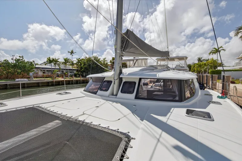 Slide: The Image of 2014 Fountaine Pajot Helia 44 catamaran docked under a sunny sky. - 36
