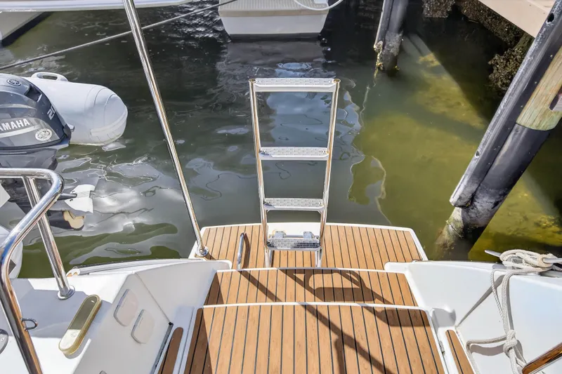 Slide: The Image of Fountaine Pajot Helia 44 catamaran stern with swim ladder, docked in marina, 2014 model. - 40