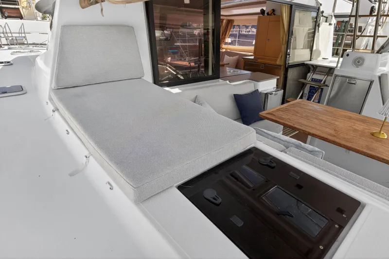 Slide: The Image of Luxurious 2014 Fountaine Pajot Helia 44 yacht interior with cushioned seating and wooden table. - 41