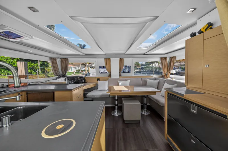 Slide: The Image of Luxurious interior of 2014 Fountaine Pajot Helia 44 catamaran with modern kitchen and seating area. - 42