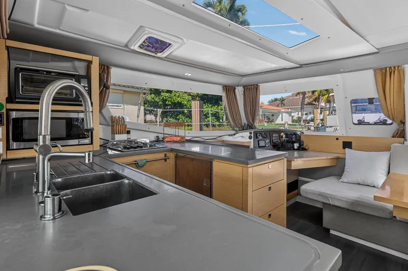 Slide: The Image of Luxurious interior of 2014 Fountaine Pajot Helia 44 catamaran with modern kitchen amenities. - 43