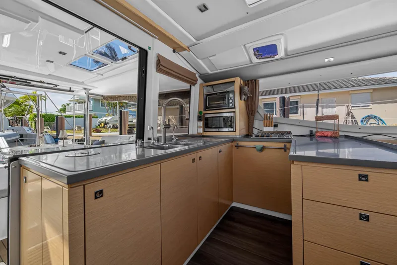 Slide: The Image of Modern kitchen interior of 2014 Fountaine Pajot Helia 44 catamaran with sleek countertops and appliances. - 44