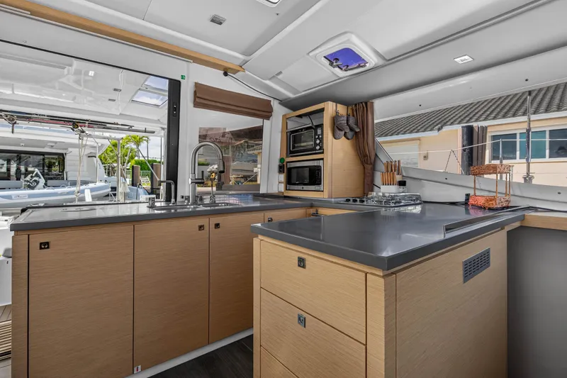 Slide: The Image of Modern kitchen interior of 2014 Fountaine Pajot Helia 44 catamaran with sleek countertops and appliances. - 45