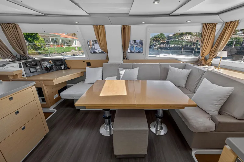 Slide: The Image of Luxurious interior of 2014 Fountaine Pajot Helia 44 catamaran with spacious seating and navigation area. - 48