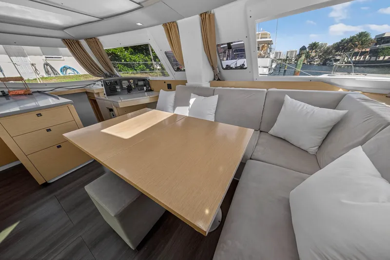 Slide: The Image of Luxurious interior of 2014 Fountaine Pajot Helia 44 catamaran with spacious seating and dining area. - 50