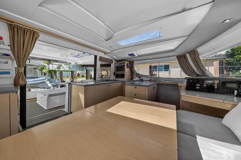 Slide: The Image of Interior of 2014 Fountaine Pajot Helia 44 catamaran, featuring modern kitchen and seating area. - 51