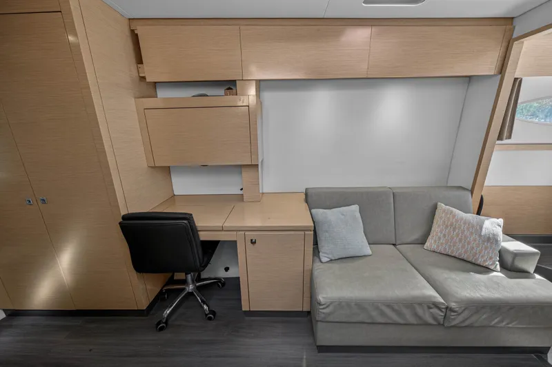 Slide: The Image of Interior of 2014 Fountaine Pajot Helia 44 with desk, chair, and sofa. - 58