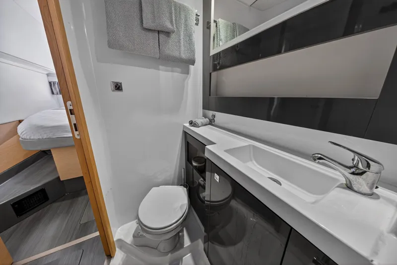Slide: The Image of Bathroom interior of 2014 Fountaine Pajot Helia 44 catamaran, featuring modern sink and toilet. - 74
