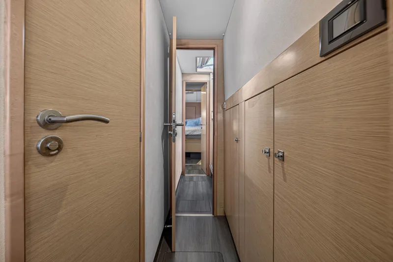Slide: The Image of Interior hallway of 2014 Fountaine Pajot Helia 44 catamaran, featuring wooden doors and modern design. - 75