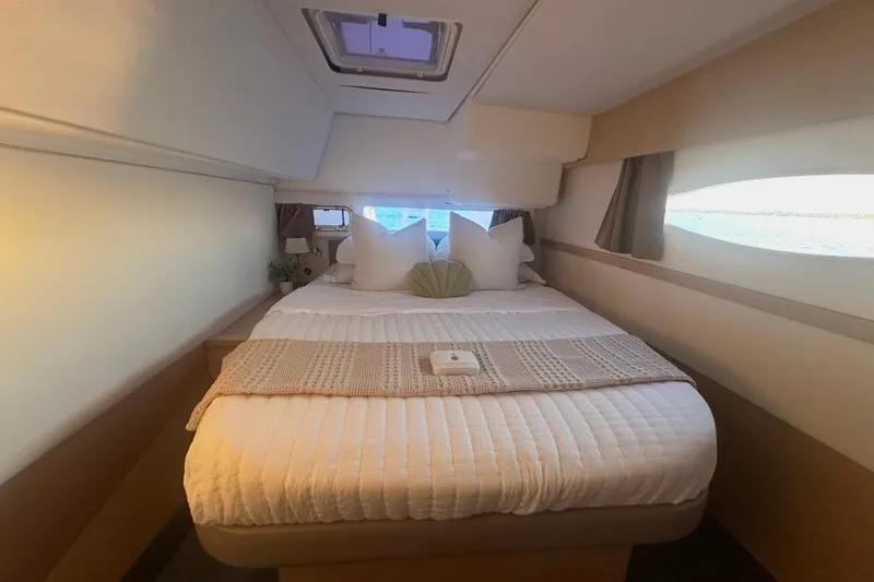 Slide: The Image of Luxurious cabin interior of 2014 Fountaine Pajot Helia 44 catamaran with cozy bedding. - 8