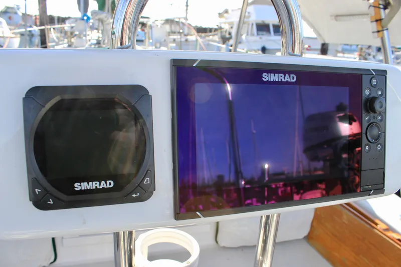 Slide: The Image of Simrad navigation equipment on a 1997 Valiant 39 sailboat, featuring dual displays. - 24