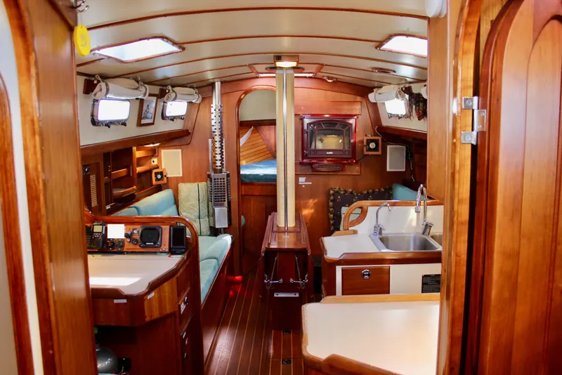 Slide: The Image of Interior of a 1997 Valiant 39 sailboat with wood finish and cozy seating. - 34
