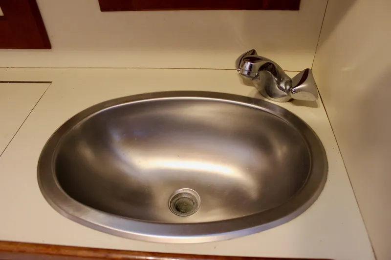 Slide: The Image of Stainless steel sink with modern faucet in a 1997 Valiant 39 yacht. - 39