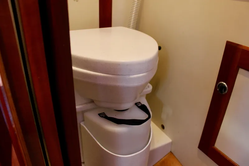 Slide: The Image of Compact marine toilet in a 1997 Valiant 39 sailboat bathroom. - 40