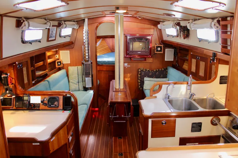 Slide: The Image of Interior of a 1997 Valiant 39 sailboat with wood finishes and cozy seating. - 44