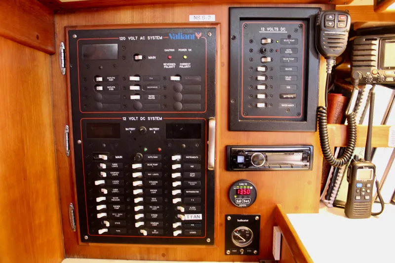 Slide: The Image of Electrical control panel on a 1997 Valiant 39 yacht, featuring AC and DC systems. - 53