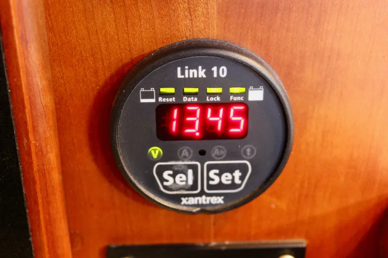 Slide: The Image of Xantrex Link 10 battery monitor displaying 13.45 volts on a Valiant 39, 1997 model. - 57