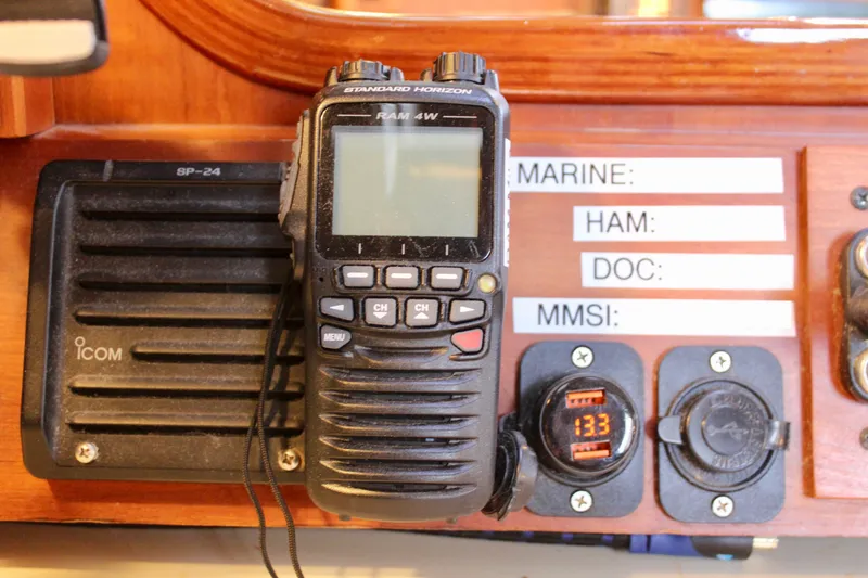Slide: The Image of Radio equipment on a 1997 Valiant 39 sailboat dashboard with communication labels. - 58