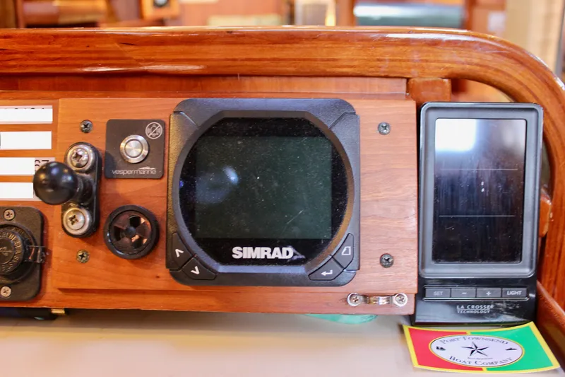 Slide: The Image of Control panel of a 1997 Valiant 39 boat with Simrad navigation system. - 59