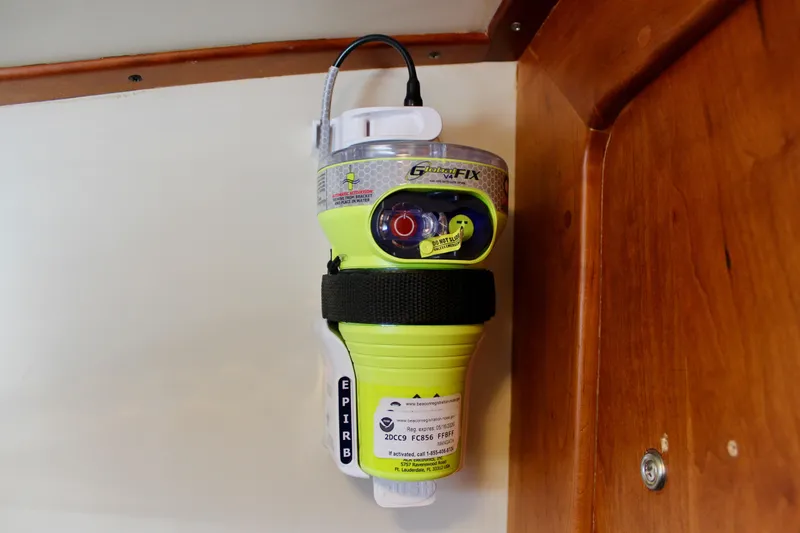 Slide: The Image of EPIRB device mounted on a 1997 Valiant 39 boat interior wall. - 61