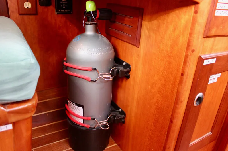 Slide: The Image of Securely mounted scuba tank inside a 1997 Valiant 39 sailboat cabin. - 63