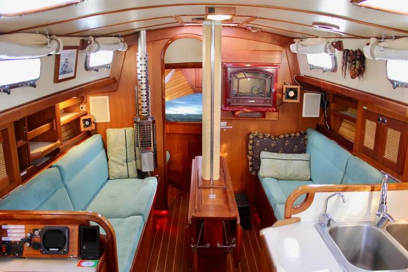 Slide: The Image of Interior of 1997 Valiant 39 sailboat with cozy seating and wooden finishes. - 64