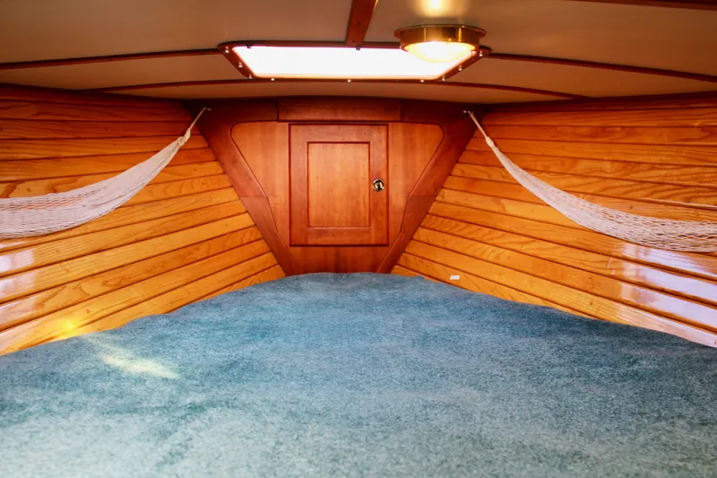 Slide: The Image of Cozy interior of 1997 Valiant 39 sailboat with wood paneling and blue carpet. - 78