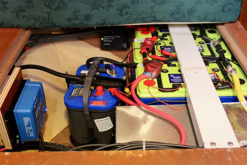 Slide: The Image of Battery compartment of a 1997 Valiant 39 yacht, featuring engine and auxiliary batteries. - 83