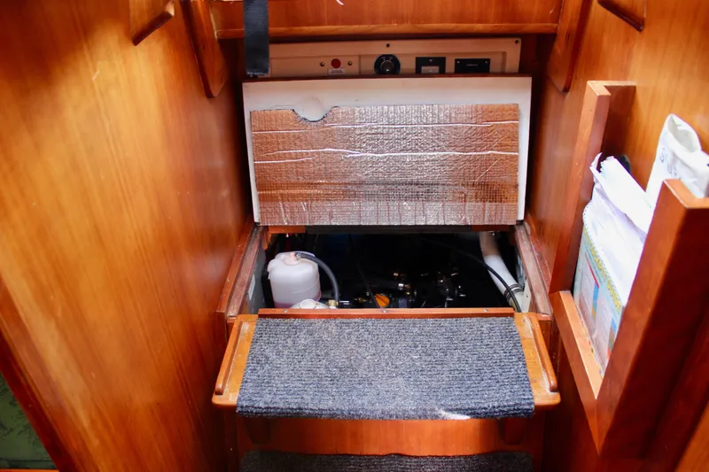 Slide: The Image of 1997 Valiant 39 yacht engine compartment with insulation and storage shelves. - 88
