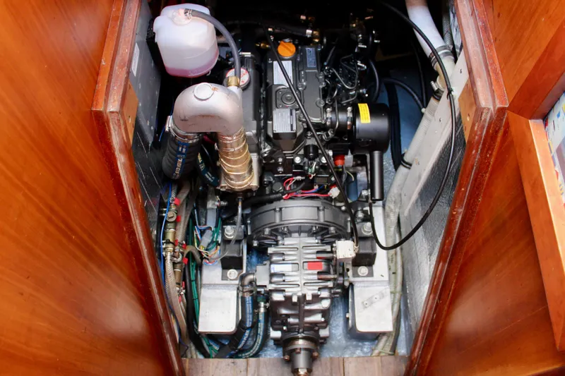 Slide: The Image of Engine compartment of a 1997 Valiant 39 sailboat, showcasing detailed mechanical components. - 89
