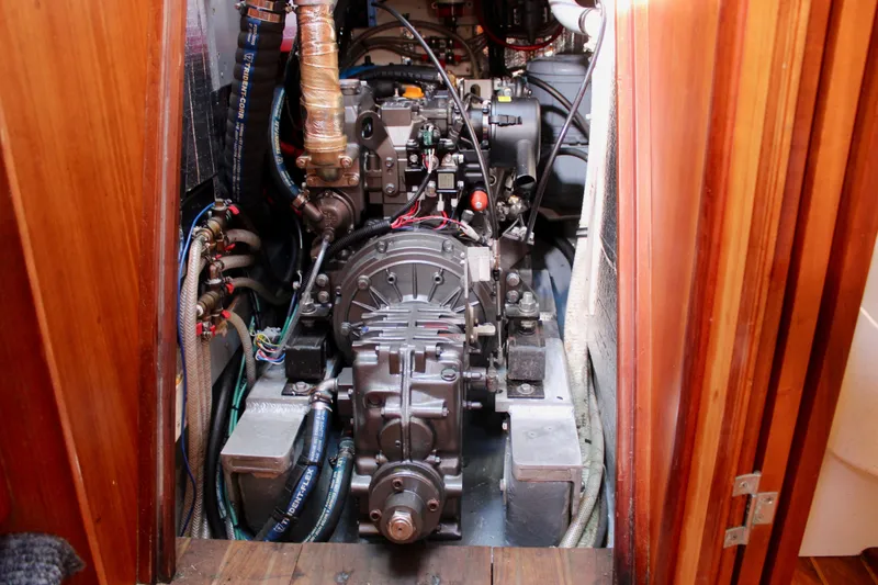 Slide: The Image of Engine compartment of a 1997 Valiant 39 sailboat, showcasing mechanical components and wiring. - 90