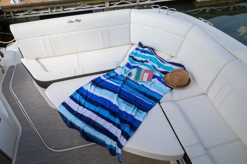 Slide: The Image of Manufacturer Provided Image: 2020 Sea Ray Sundancer 320 boat with white seating and blue striped towel. - 10