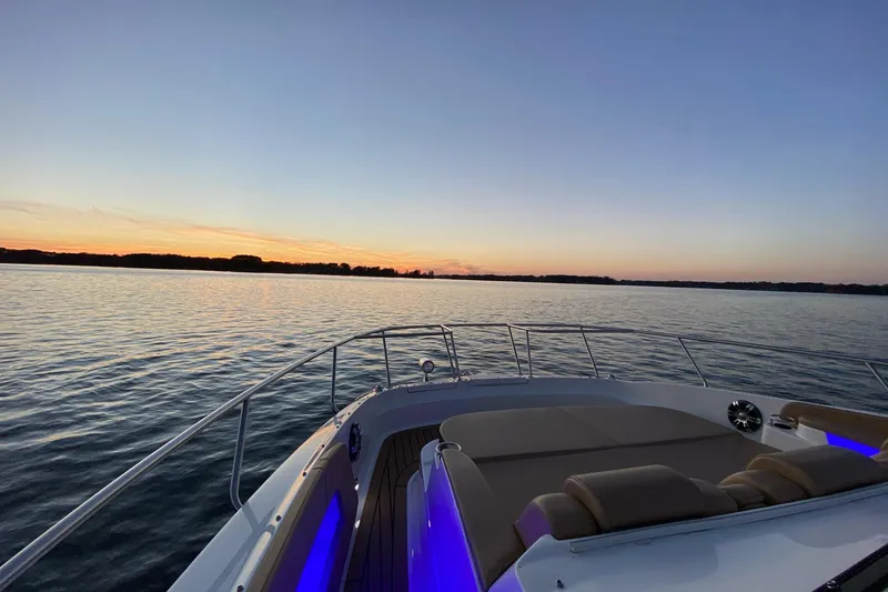 Slide: The Image of 2020 Sea Ray Sundancer 320 yacht at sunset on calm waters. - 4
