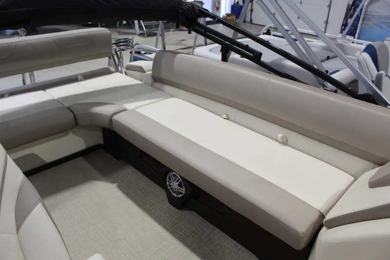 Slide: The Image of 2025 Avalon 2385 25 Catalina CRB boat interior with beige seating and modern design. - 10