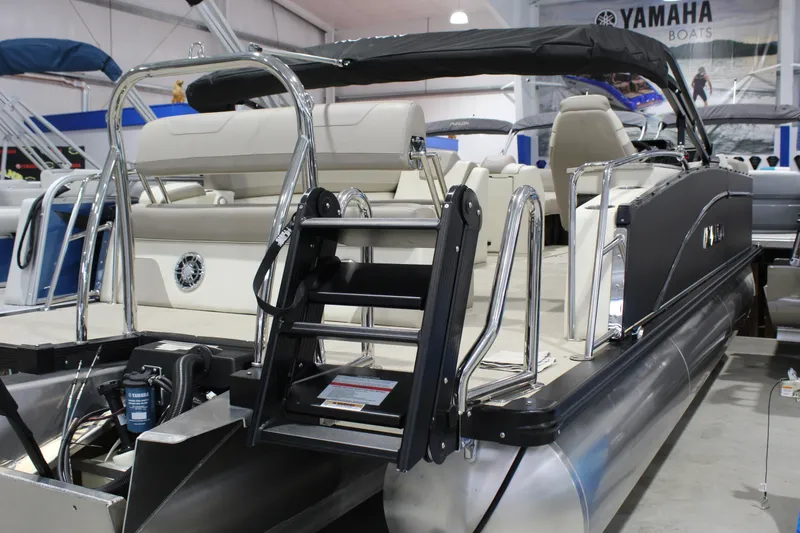Slide: The Image of 2025 Avalon 2385 25 Catalina CRB pontoon boat with Yamaha engine in showroom. - 2