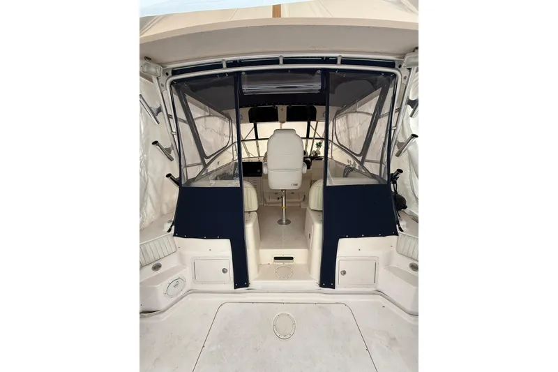 Slide: The Image of 2005 Grady-White Express 330 boat interior with seating and helm station. - 13