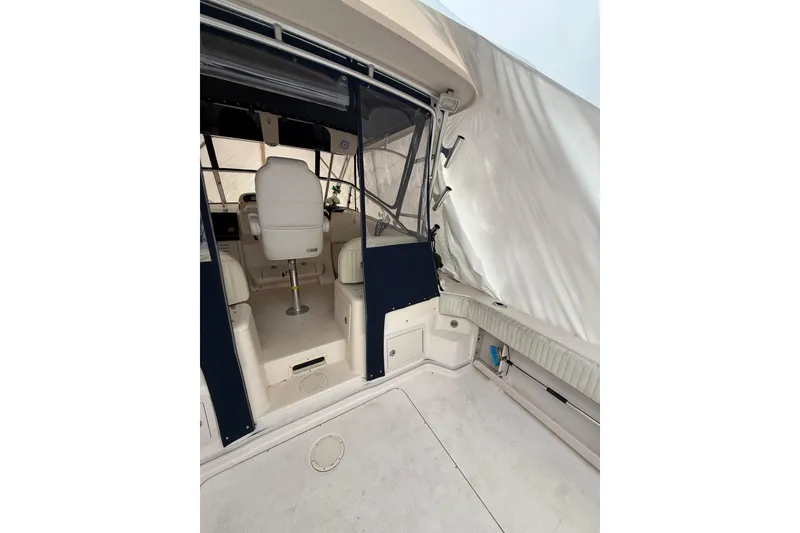 Slide: The Image of 2005 Grady-White Express 330 boat interior with seating and helm area. - 18