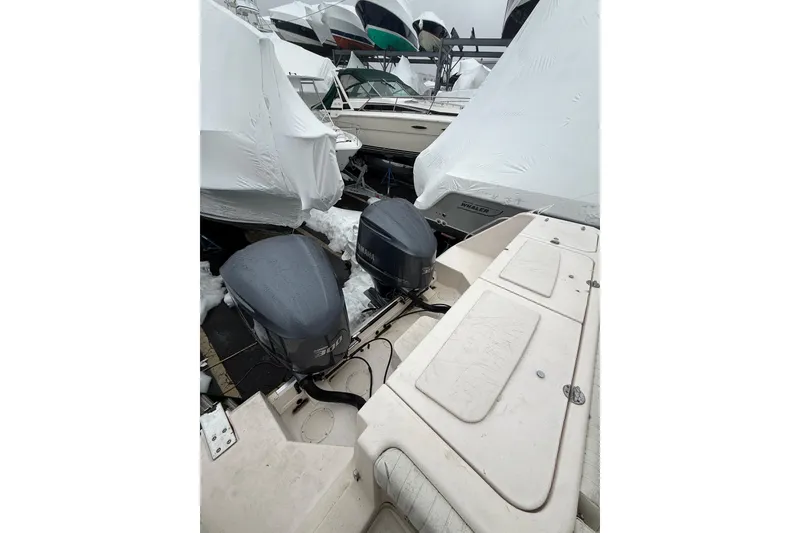 Slide: The Image of 2005 Grady-White Express 330 boat with twin Yamaha outboard engines in storage. - 20