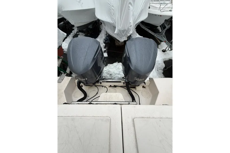 Slide: The Image of 2005 Grady-White Express 330 with twin outboard engines, covered in snow. - 21