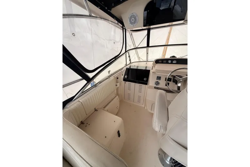 Slide: The Image of Interior view of 2005 Grady-White Express 330 boat cockpit with steering wheel and seating. - 25