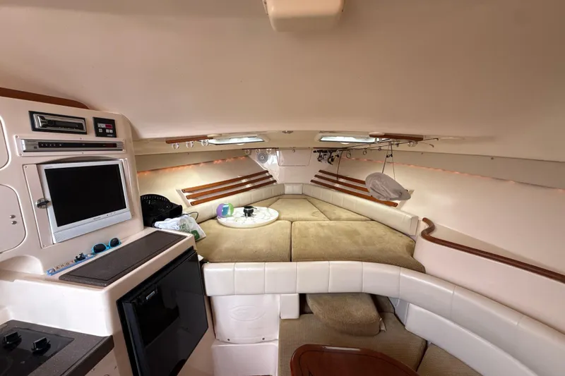 Slide: The Image of Interior of 2005 Grady-White Express 330 boat with cozy seating and entertainment area. - 28