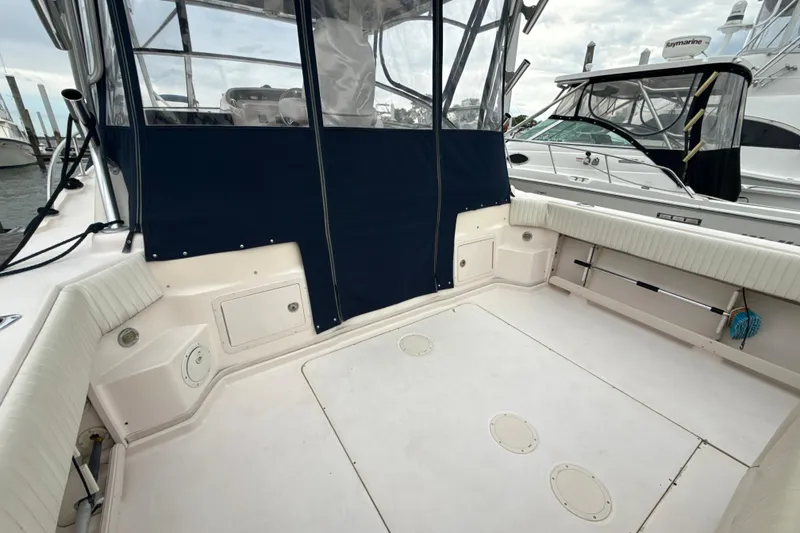 Slide: The Image of 2005 Grady-White Express 330 boat deck with seating and protective cover. - 35