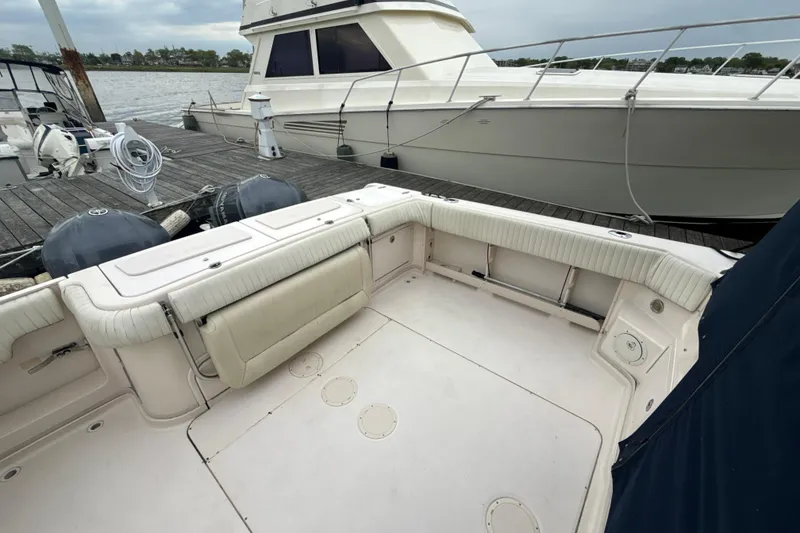 Slide: The Image of 2005 Grady-White Express 330 boat interior, docked with visible seating and deck area. - 39