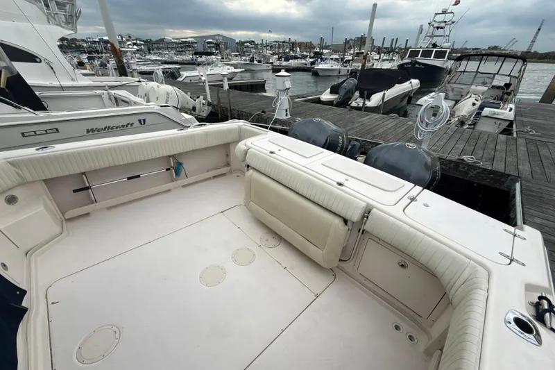 Slide: The Image of 2005 Grady-White Express 330 boat docked at marina with Yamaha engines. - 40