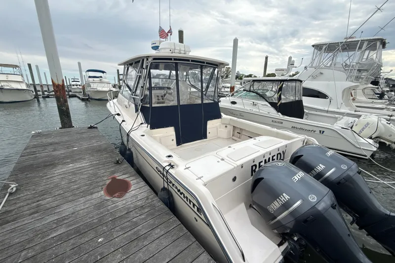 Slide: The Image of 2005 Grady-White Express 330 boat docked with twin Yamaha engines. - 45