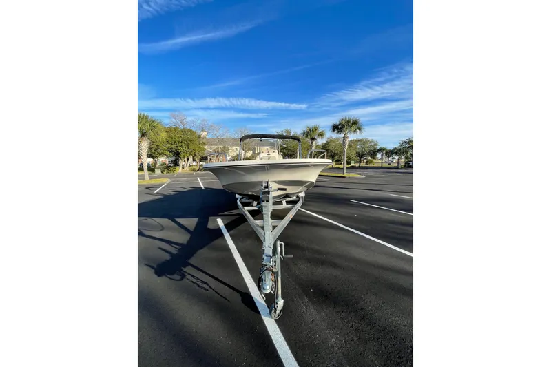 Slide: The Image of 2023 Carolina Skiff 21 LS boat on trailer in sunny parking lot. - 4