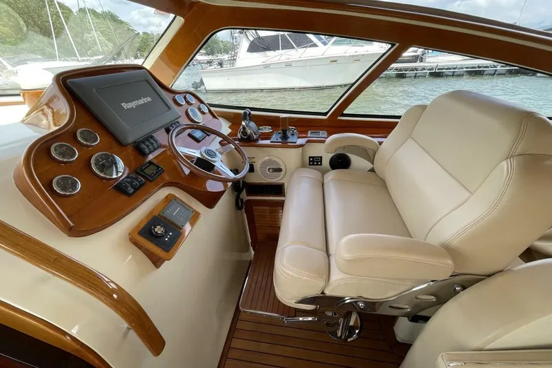 Slide: The Image of Luxurious helm of 2012 Hinckley Runabout 38 with leather seating and advanced controls. - 4