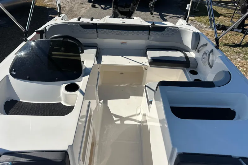 Slide: The Image of 2022 Bayliner Element M17 boat interior with seating and steering console. - 11