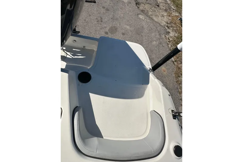 Slide: The Image of 2022 Bayliner Element M17 boat deck with seating and cup holder. - 15