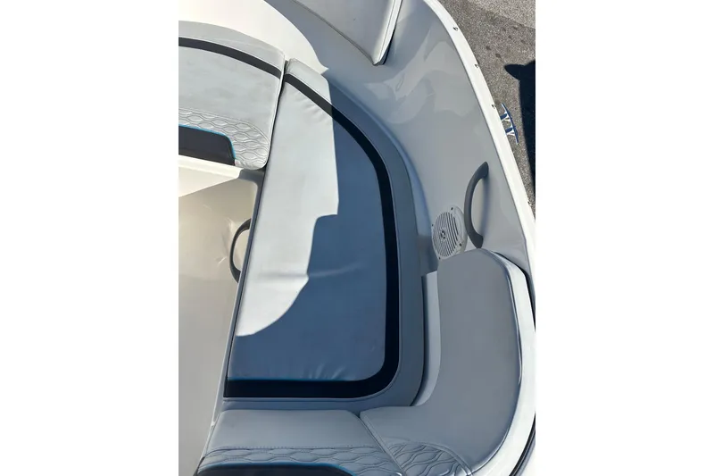 Slide: The Image of 2022 Bayliner Element M17 boat interior with cushioned seating and speaker. - 9